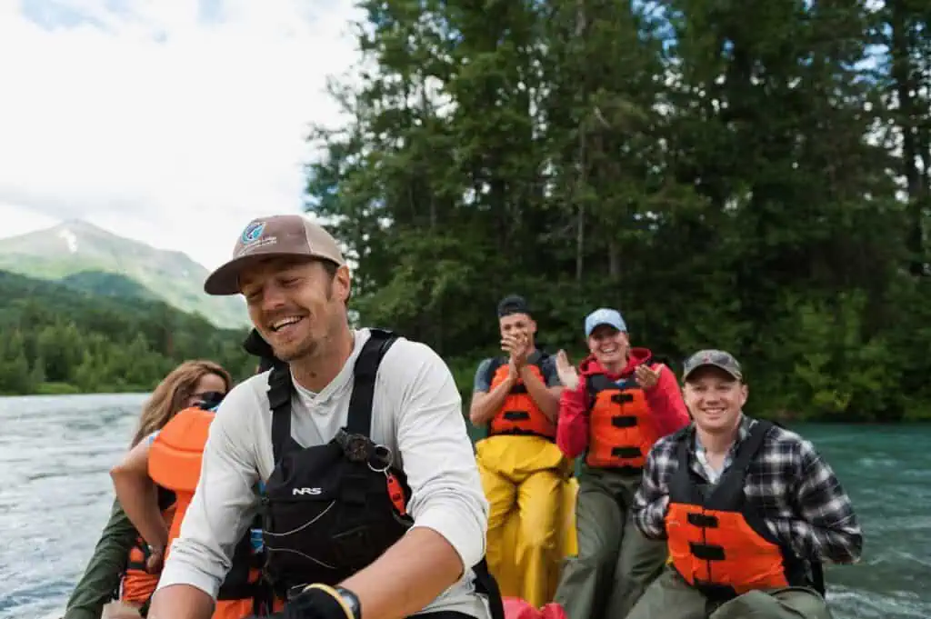 Smiling people rafting the Kenai River